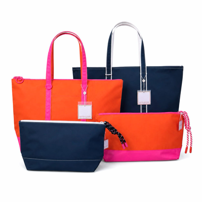large water resistant totes and toiletry bags in orange and blue