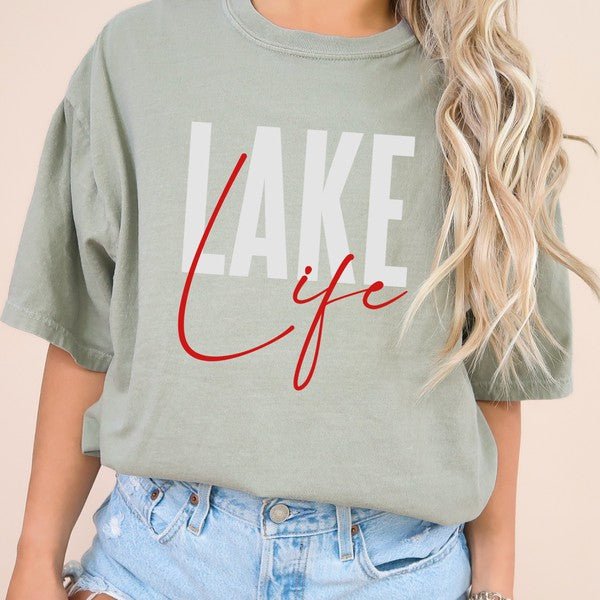 Person wearing a green t-shirt with 'Lake Life' text